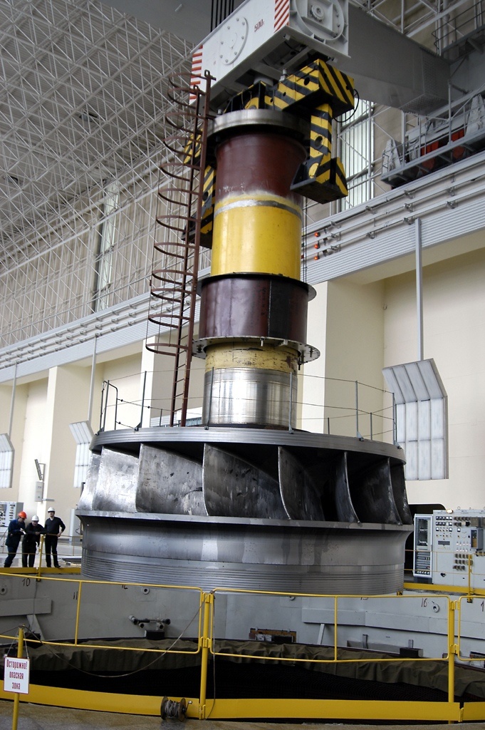 Working wheel on shaft with generator rotor