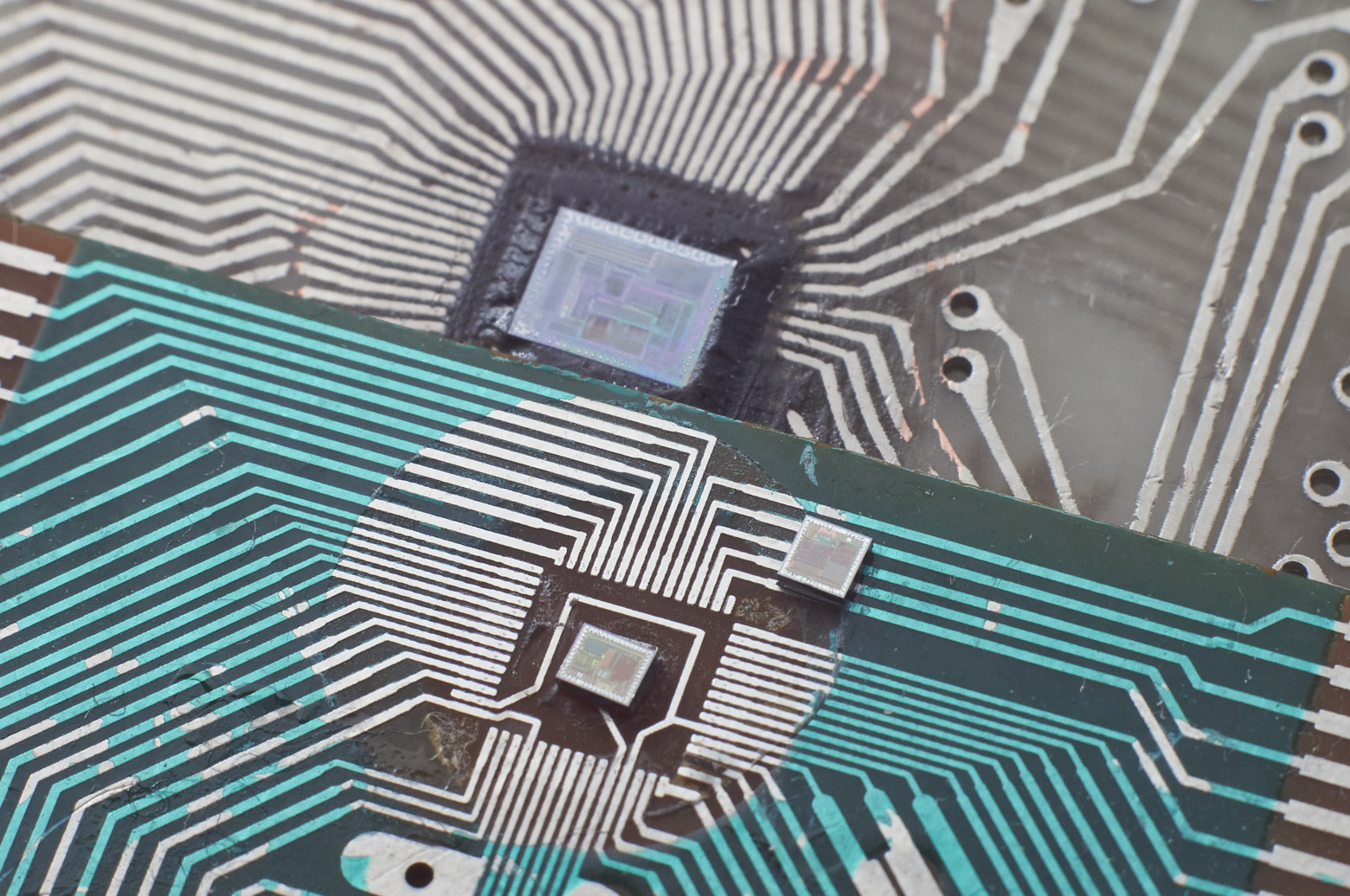 Microcontroller dies used in Brick Game, from 1993, 2003, and 2008 (left to right)